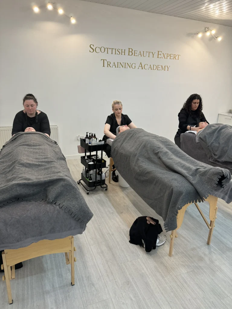 Lymphatic drainage massage technique demonstrated during training